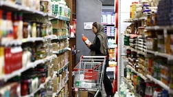 A woman in Tehran shops for groceries, some of which are becoming too expensive for the average Iranian to buy. Reuters