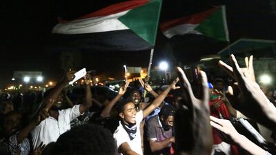 Sudanese protesters celebrate after an agreement was reached with the military council to form a new transitional government. Ashraf Shazly / AFP