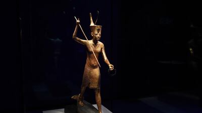 A gilded wooden figure of Tutankhamun throwing a harpoon, dated 1336-1326 BC. EPA