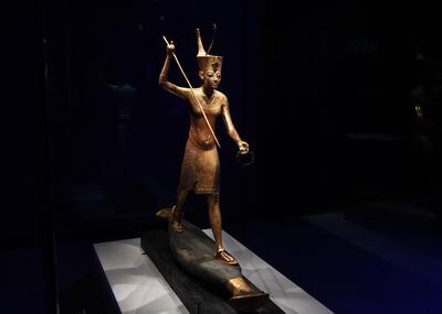 A gilded wooden figure of Tutankhamun throwing a harpoon, dated 1336-1326 BC. EPA