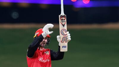 Colin Munro of Desert Vipers raises his bat after scoring a fifty. ILT20 / CREIMAS