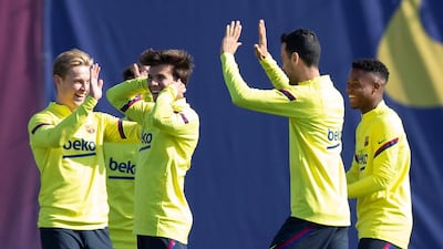 Barcelona's Frenkie de Jong, from left, Riqui Puig, Sergio Busquets and Ansu Fati during training on Friday. EPA