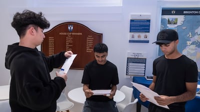 From left, Qiaozhi Zhang, Ibrahim Tanner and Amara Jaffe Asaria at Brighton College Dubai. Antonie Robertson / The National