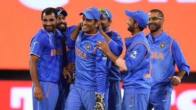 Captain MS Dhoni, centre, says India will continue to play to their strengths. Andy Brownbill / AP photo