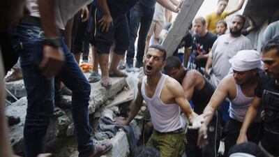 Palestinians dig through the rubble of a building searching for bodies after what police said was an Israeli air strike at Shati (beach) refugee camp in Gaza City on August 4, 2014. Reuters