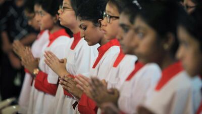 A group of altar boys and girls at the outdoor Christmas mass held at St Joseph’s church in Abu Dhabi. Ravindranath K / The National