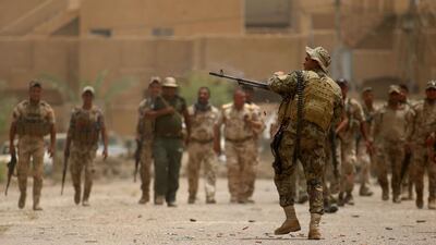 Iraqi forces battle with Islamic State militants in the Officers neighbourhood of Fallujah.