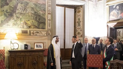 Matteo Renzi, Prime Minister of Italy, second left, shows Sheikh Mohammed bin Zayed, Crown Prince of Abu Dhabi and Deputy Supreme Commander of the Armed Forces, left, the Mayor of Florence’s office prior to a meeting at Museo di Palazzo Vecchio. They are seen with Dario Nardella Mayor of Florence, right. Ryan Carter / Crown Prince Court - Abu Dhabi