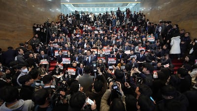South Korean MPs and members of opposition parties gather at the National Assembly in Seoul, amid political unrest in the country. AP