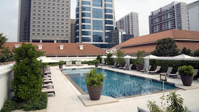 Loungers surround the swimming pool at the Raffles Hotel. Bloomberg