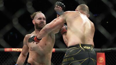 Jiri Prochazka throws a punch at Glover Teixeira during their light heavyweight title fight at UFC 275. AFP