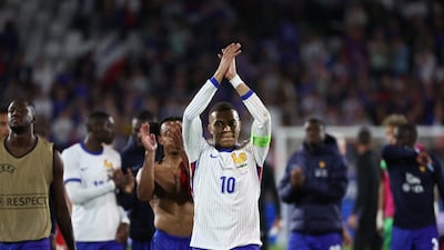 Kylian Mbappe applauds the crowd at the end of the friendly match between France and Canada. AFP