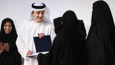 Sheikh Abdullah bin Zayed, Minister of Foreign Affairs and Chairman of the Emirates Foundation for Youth Development, presents prizes yesterday to winners of the foundation’s Think Science Awards, which aim to help “explore Emirati science talent at a young age”. Delores Johnson / The National