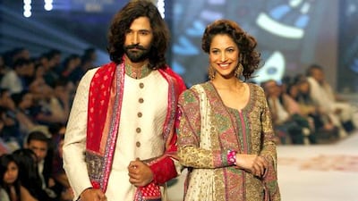 Model presents creations by Fashion Power design institute. Shakil Adil / AP photo