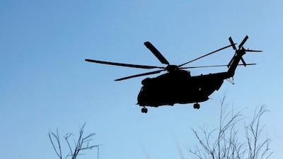 An Israeli helicopter searches the Sea of Galilee for the remains of a drone shot down by Israel. AFP