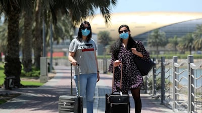Lina (right) and Ahlam Barhomi say they are looking forward to seeing family back home in France and the UK. Chris Whiteoak / The National