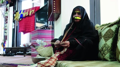 Haleema Ali Al Shehhi, who weaves palm fronds at the National Theatre in Abu Dhabi. Christopher Pike / The National