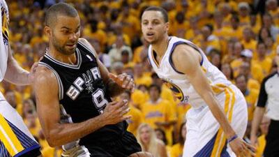 The Golden State Warriors managed to stop Tony Parker's Spurs despite an injury to the Warriors' Stephen Curry, right. Robert Galbraith / Reuters