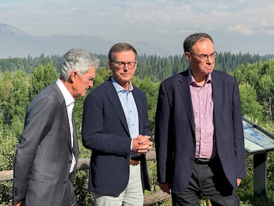 US Federal Reserve chairman Jerome Powell, Bank of Canada governor Tiff Macklem and Bank of England governor Andrew Bailey break outside the Kansas City Fed's annual symposium in Wyoming in 2024. Reuters