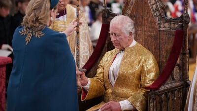 Ms Mordaunt presents the Sword of State to King Charles. AP