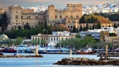 Mandraki Harbour of Rhodes town is dominated by the brooding mass of the Palace of the Grand Masters, a reminder of its medieval glory.