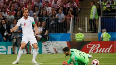 Harry Kane sees his shot saved before he hits the rebound against the post in the first half. EPA