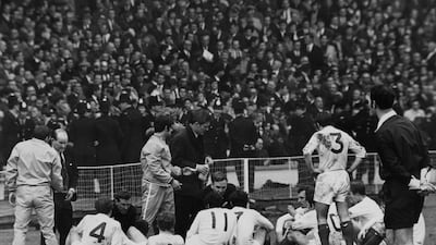 Leeds United manager Don Revie, centre, gives a pep talk to his exhausted team before extra time during the FA Cup final between Leeds and Chelsea at Wembley, April 11, 1970. Getty