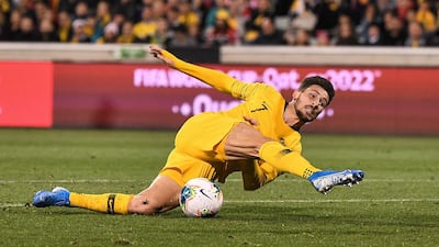 Mathew Leckie of Australia slips whilst taking a shot during the World Cup qualifier against Nepal in Canberra, on Thursday, October 11. Reuters
