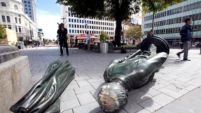 A toppled statue of John Robert Godley in Cathedral Square on February 24, 2011, two days after a deadly 6.3 magnitude earthquake rocked Christchurch. AFP