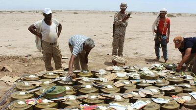 Yemeni security forces assemble land mines and explosives seized from Al Qaeda before destroying them in the desert of Al Alam, east of Aden, on Apil 29, 2016. Saleh Al Obeidi / AFP