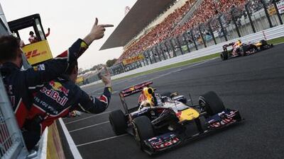 Sebastian Vettel celebrates winning his second world title after finishing third in yesterday's Japanese Grand Prix.
