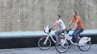 The ADCB Bikeshare scheme was launched on Yas Island last month. Above, above tourists from Italy cycle around the island. Mona Al Marzooqi / The National