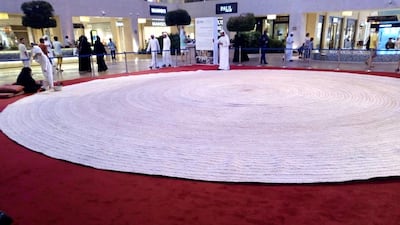 The largest hand-woven spiral placemat was made by the Cultural Programs and Heritage Festival Committee (UAE) in Abu Dhabi. Photo Guinness World Records