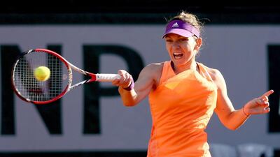 Simona Halep will try to win her first grand slam on Saturday but the 22-year-old Romanian will have to get past Russia’s Maria Sharapova in the French Open final at Roland Garros. Matthew Stockman / Getty Images