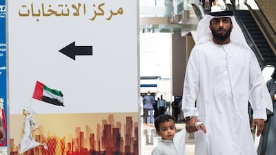 A voter arrives at the polling station in Dubai World Trade Centre as the early voting begins for the Federal National Council elections. Alex Atack for The National