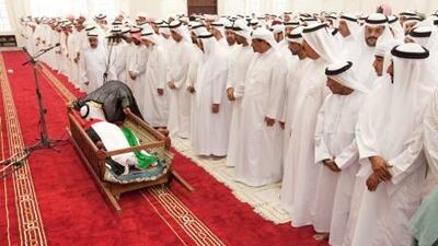 An imam kisses the body of Sheikh Saqr bin Mohammed Al Qasimi, the Ruler of Ras al Khaimah, during his funeral prayer at the Sheikh Zayed Mosque.