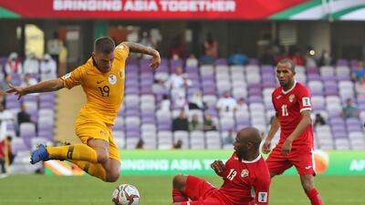 Jordan midfielder Khalil Bani Ateyah, right, tackles Australia's defender Joshua Risdon. AFP
