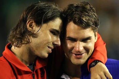 Rafa Nadal consoles Roger Federer after their grueling 2009 Australian Open final, which the Spaniard won in five sets in four hours and 23 minutes. AFP