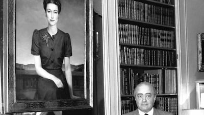 Mr Al-Fayed poses with a portrait of the Duchess of Windsor, in Boulogne-Billancourt, France. Getty Images