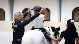 Ghaith Al Suwaidi and horse trainer Faye Galvin at Abu Dhabi Equestrian Club. Chris Whiteoak / The National