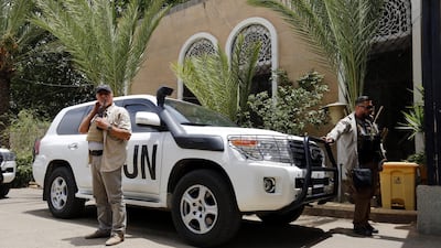 UN bodyguards escort the motorcade of UN special envoy for Yemen Martin Griffiths at Sanaa airport. EPA