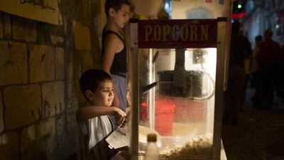 Children manning a popcorn stall in the old market.