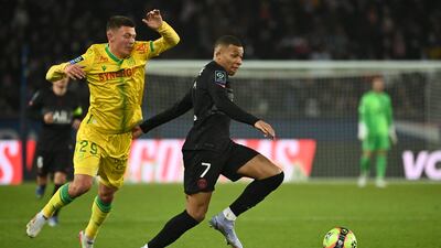Paris Saint-Germain's French forward Kylian Mbappe fights for the ball with Nantes' French midfielder Batista Mendy. AFP