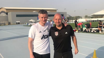 Kirk Hilton, right, alongside Manchester United manager Ole Gunnar Solskjaer. Courtesy photo