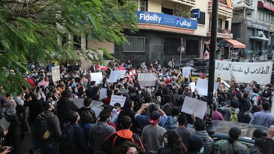 Students from different universities carry placards, wave Lebanese flags during a demonstration under the slogan of 'A Day of Student Rage' in Al-Hamra, Beirut. EPA