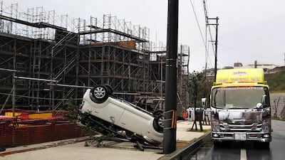 An overturned car from the strong winds generated by Typhoon Trami, in Kitanakagusuku, the southern island of Okinawa, Japan. EPA