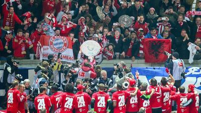 Bayern players jubilate with a mock championship shield after beating Hertha Berlin and clinching the Bundesliga title on Tuesday night. Hannibal Hanschke / EPA / March 25, 2014