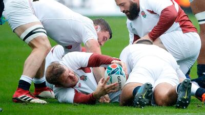 England's lock Joe Launchbury is tackled during a training session. AFP