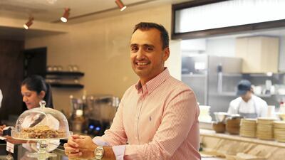 Nicholas Couvaras, the owner and founder of Refresh Delux Café, in DIFC's Marble Walk. Nicholas Couvaras, says he sold his Porsche after his daughter was born. Pawan Singh / The National