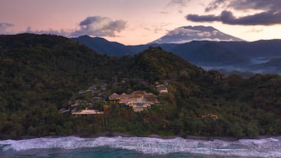 Spread across 12 hectares on Bali's east coast, Amankila's pavilions tumble down the cliffs towards a secluded black-sand beach. Photo: Aman